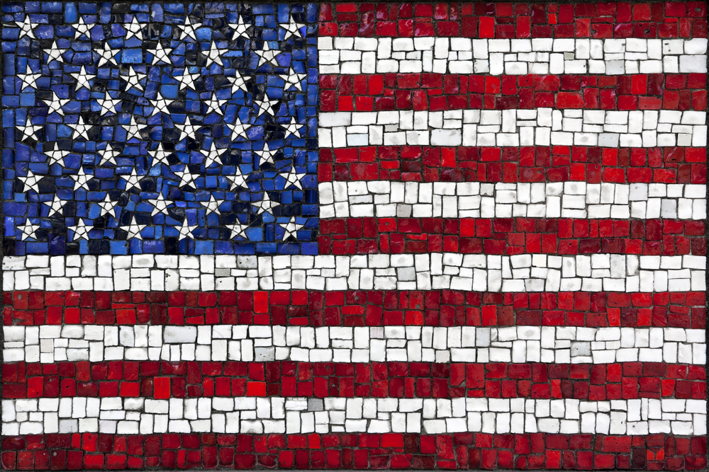 Small individual tiles of various sizes make up an image of the American flag